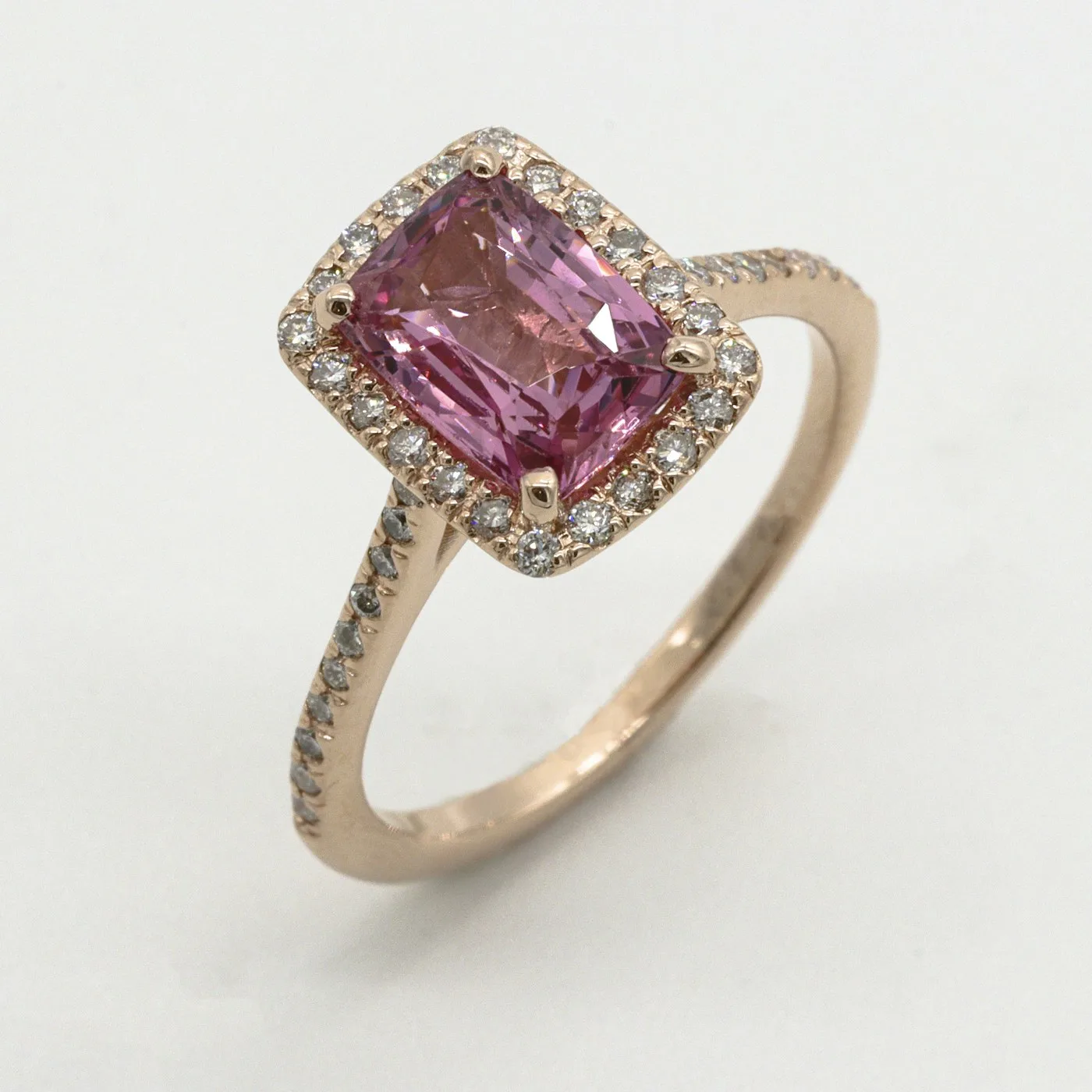 Representative yellow gold jewelry image catching direct sunlight on a pale stone